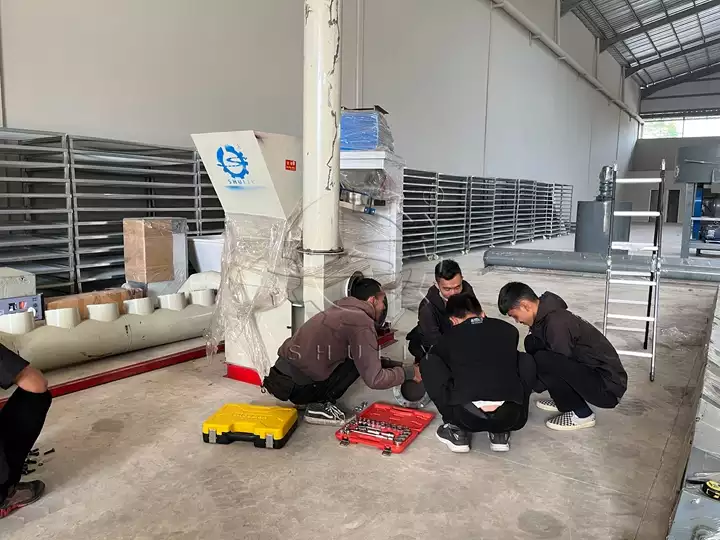 engineers check machine components